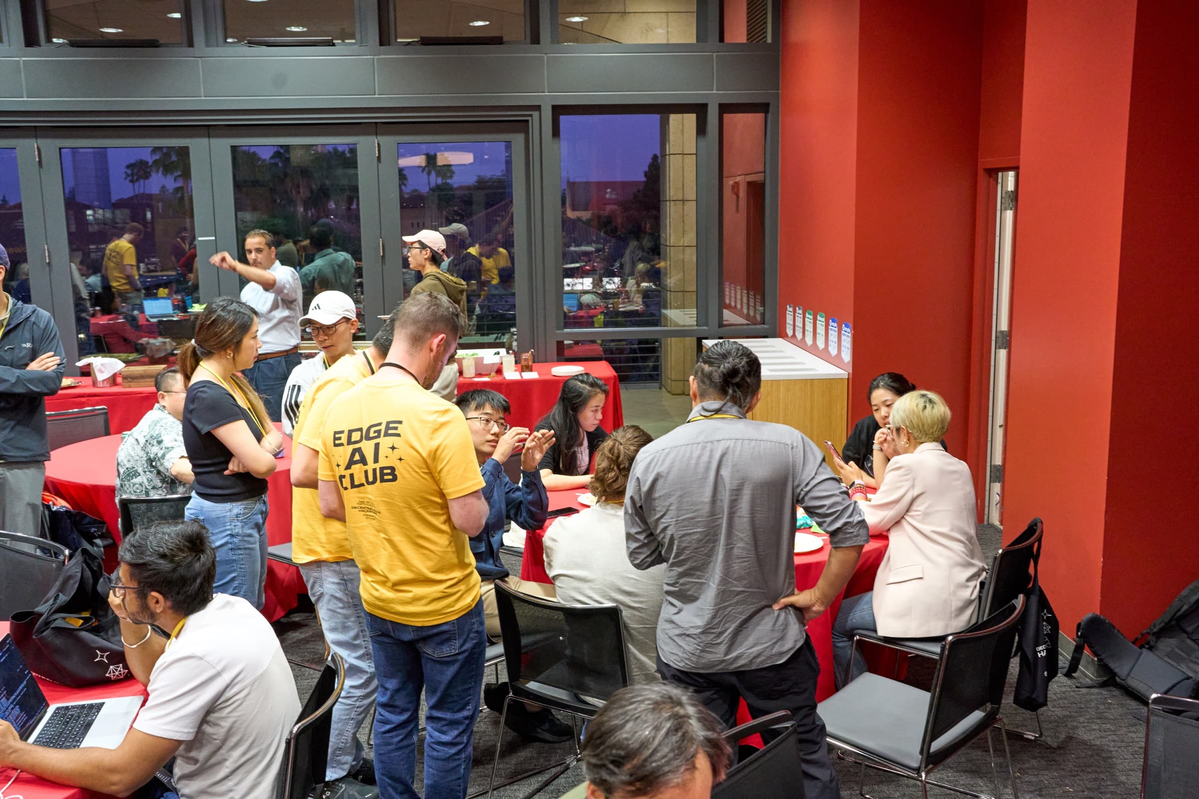 Hackathon attendees exchanging ideas and meeting collaborators